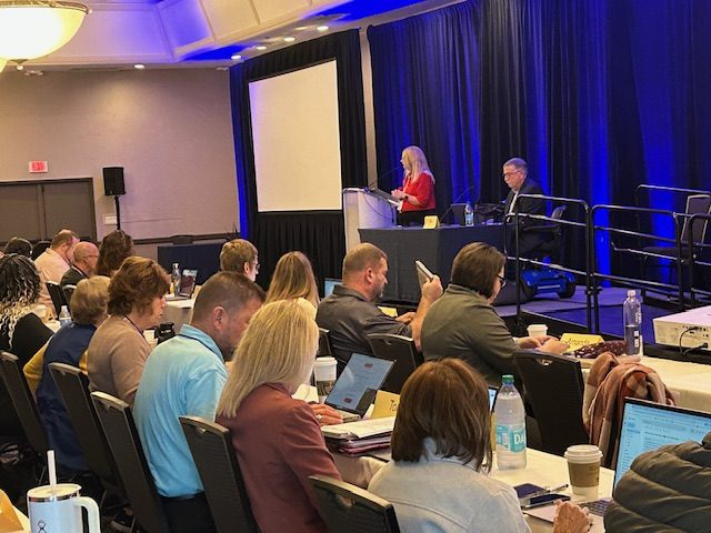 NAADAC Annual Conference — attendees and faculty presenter on stage